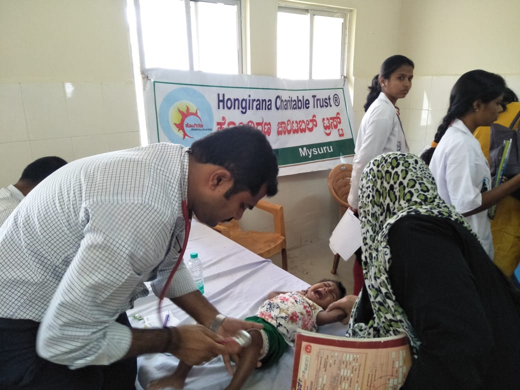 An infant being examined at a Hongirana Charitable Trust screening camp in Mysuru.