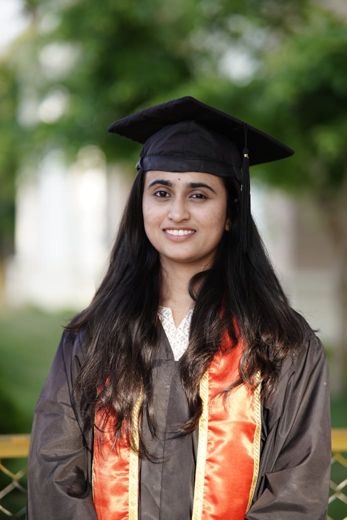 Manasa K S in her graduation cap and gown after completing MBBS at CIMS Chamarajanagar