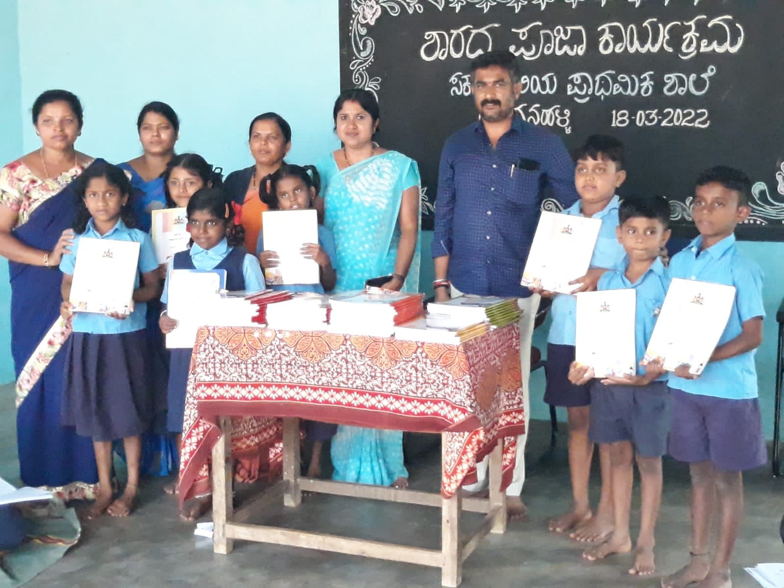 Notebooks, textbooks and supplementary readers handed over to the school library.